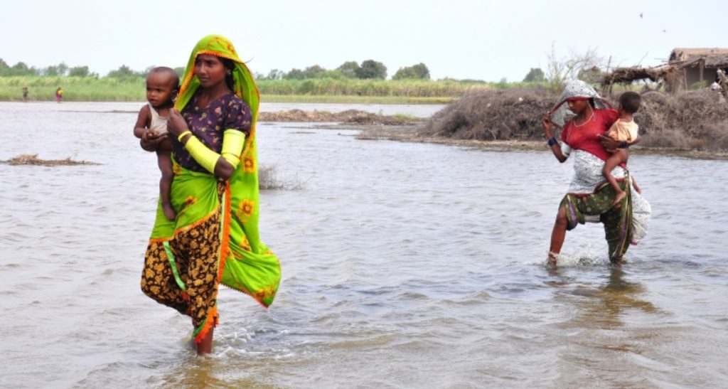 Women crossing floods